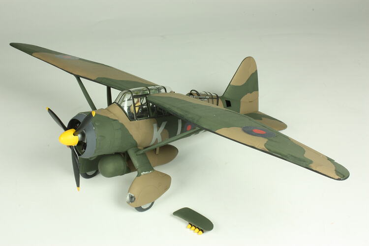 Model aeroplane with khaki camouflage pattern.