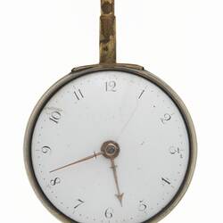 Pocket watch within gilt and tortoise shell case. White dial that has Arabic numerals.