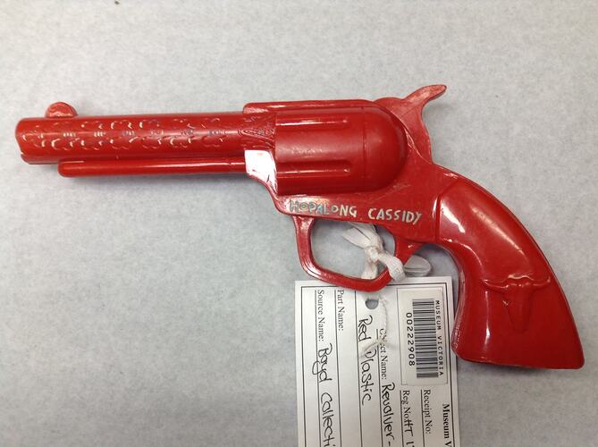 Red plastic toy revolver.