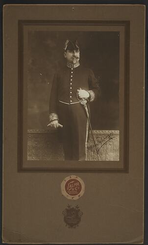 Portrait of Dr Constantine Kyriazopoulos (Krizos) in military uniform. Standing holding a sword.