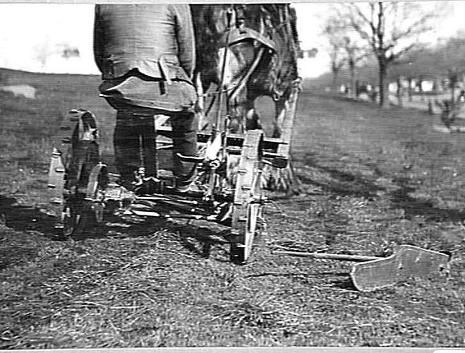 M-H MOWER FITTED WITH LOW-CUT BAR WORKING ON LAWNS NEAR SHRINE: AUG 1934