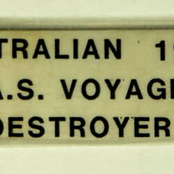 Grey coloured naval ship, label.