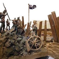 Detail of model of figurines representing soldiers and miners engaged in fighting.