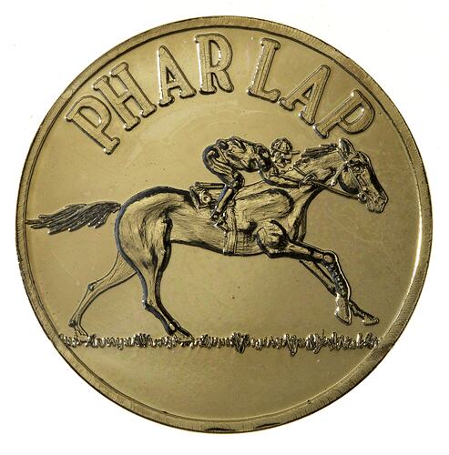 Gold medal with race horse design.