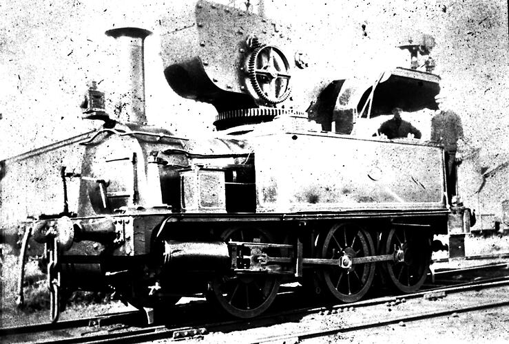 [A locomotive steam crane, about 1920.]