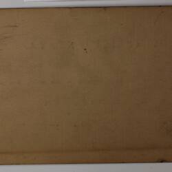 Back of off-white rectangular label.