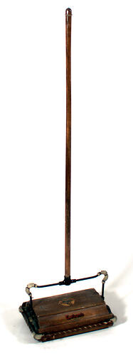 Carpet sweeper, wooden handle and sweeper pan, shown upright. Base has colour logo and text.