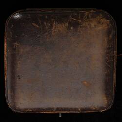 Underside of square jewellery case. Rounded corners.