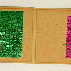 Open needlebook showing needles within.
