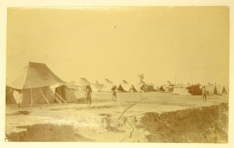 Soldiers walking around army encampment on banks of Tigris.