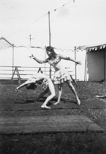 Digital Photograph - Holden Brothers Circus, Two Girls Practice Tumbling on a Mat with 'Big Top' behind, Inverloch, late 1940s