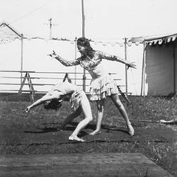 Digital Photograph - Holden Brothers Circus, Two Girls Practice Tumbling on a Mat with 'Big Top' behind, Inverloch, late 1940s