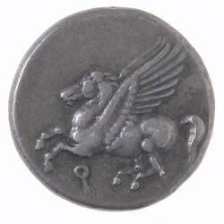 Round silver coin with Pegasus flying left. In field below is the Greek letter Koppa.