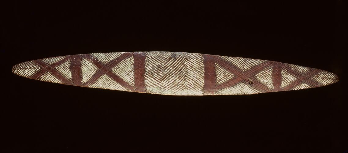 Carved wooden shield.