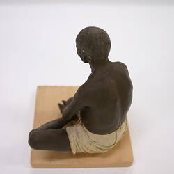 Sculpture of a man sitting