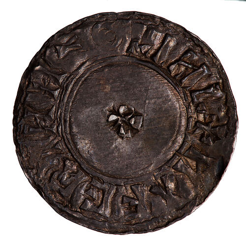 Coin, round, small cross pattee within a line circle; text around.