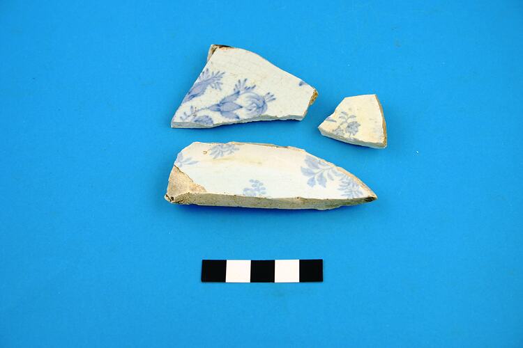Three earthenware plate base fragments.