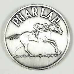 Silver medal with race horse design.