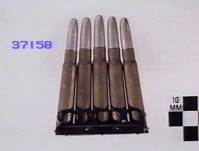 Side view of five cartridges in clip.