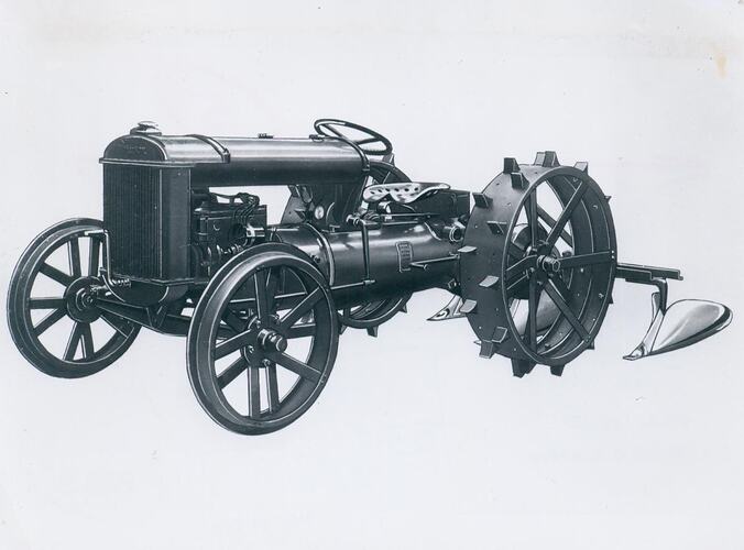 Left side view of tractor with steel wheels.