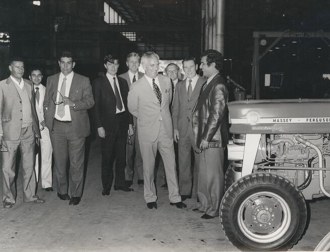 Group of men standing.