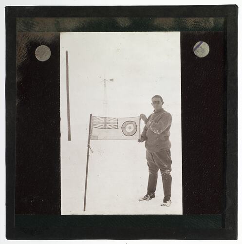 Lantern Slide - Alister Murdoch With the RAAF Flag, 'Little America', Ellsworth Relief Expedition, Antarctica, 1935-1936