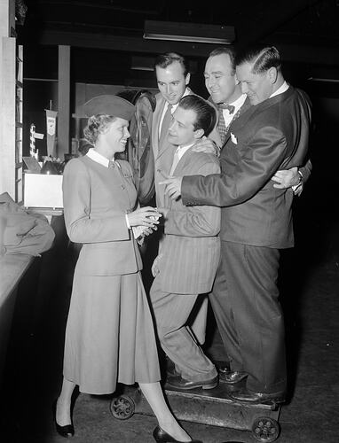 Qantas Airways Ltd, Flight Attendant with Group of Men, Melbourne, Victoria, 1956