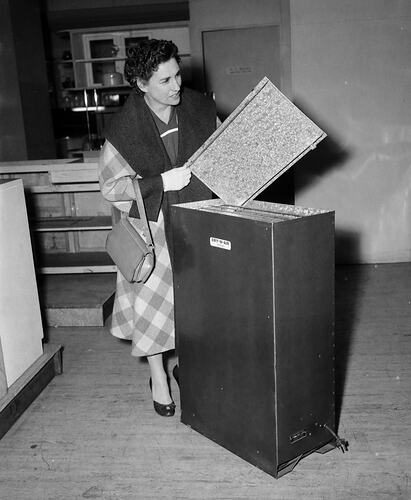 Woman with a Swiftsure Electric Clothes Dryer in a Myer Store, Melbourne, Victoria, Oct 1955
