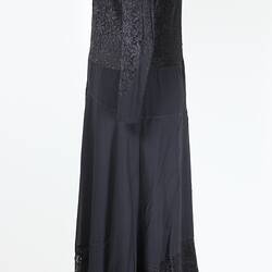 Silk and lace black dinner dress, side view.