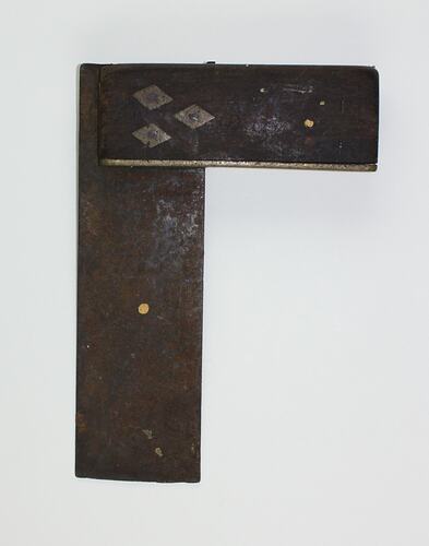 Metal, wood L-shaped set square. 3 metal nail plates.
