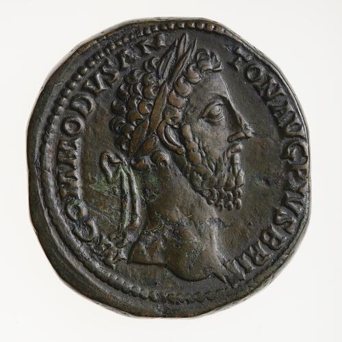 Roughly round coin. Bearded, wreathed man facing right. Text around.