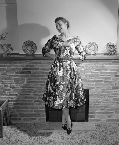 Ladies Fashion, Model Standing by Fire Place, Victoria, 12 May 1959