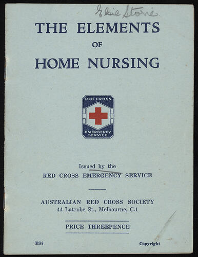 Printed booklet with red cross on blue cover.