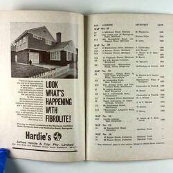 Open booklet showing Fibrolite advertisement with house photo