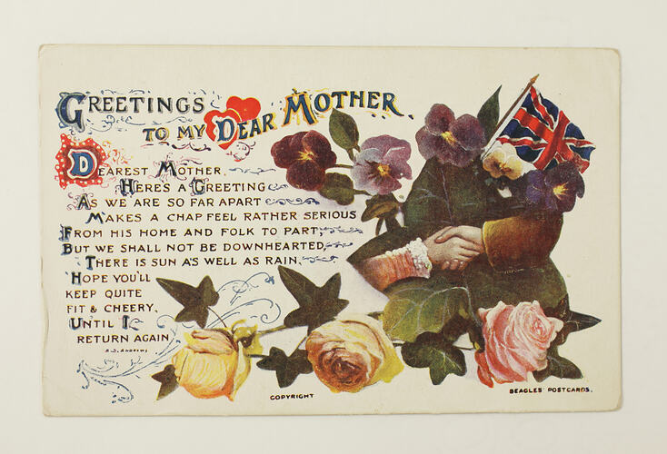 Front of postcard with coloured flowers and text.