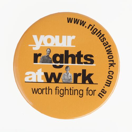 Round orange badge with black and white text.
