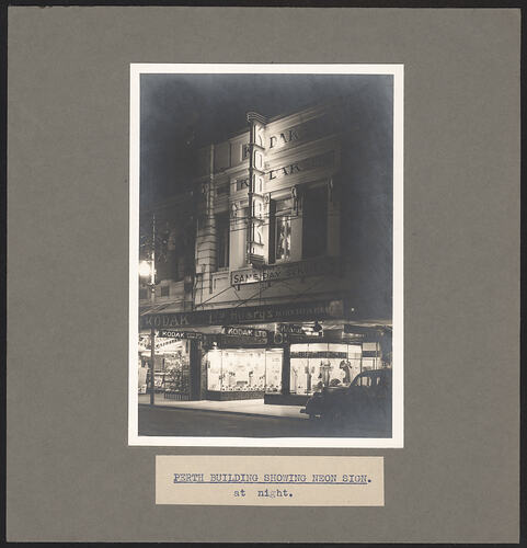 Black and white photograph of a shop exterior.