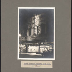 Black and white photograph of a shop exterior.