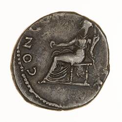 Round coin, aged, seated figure, facing left, right hand holding out a dish, left hand holding a horn.