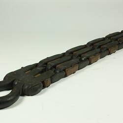 Metal chain with square links.
