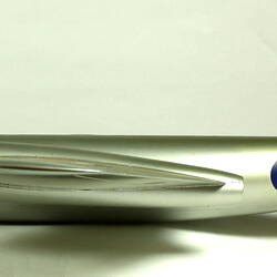 Silver model aeroplane. Profile facing left.