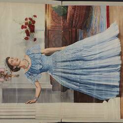 Double page of a scrapbook, both sides feature colour image of Queen Elizabeth II in a blue gown