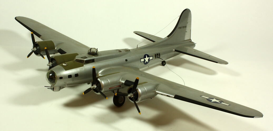 Silver model aeroplane. Three quarter front left view.