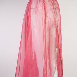 Pink chiffon mid-calf skirt. Pearl waistband, some dotted below. Silver hem.
