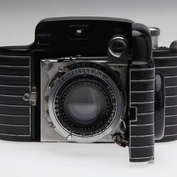 Black and silver art deco style folding camera.