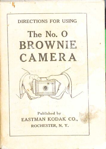 Cover page with hands holding a camera.