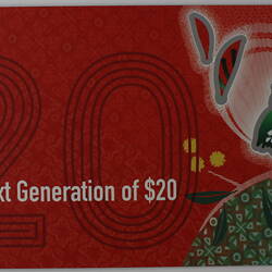 Red rectangular card with bird (kookaburra) and plant illustration and white printed text.