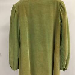 Back view of green jacket on hanger.