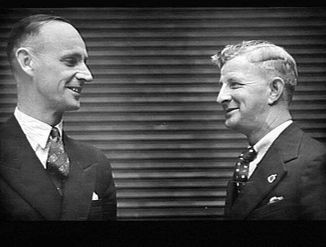 FROM INTERSTATE - ALTHOUGH THEY WORK 3,500 MILES APART, STAN EDWARDS (LEFT) AND VIC MENGEL (RIGHT) HAD MUCH IN COMMON TO DISCUSS WHEN THEY VISITED SUNSHINE RECENTLY. STAN MANAGES THE DUPLICATE DEPT. IN PERTH AND VIC HOLDS A SIMILAR POSITION IN BRISBANE. S