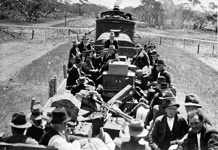 Workers in rail trucks returning home for Christmas, Millewa district, 1924.